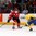 TORONTO, CANADA - DECEMBER 31: Switzerland's Luca Fazzini #21 tries to get around Sweden's Sebastian Aho #2 during preliminary round action at the 2015 IIHF World Junior Championship. (Photo by Andre Ringuette/HHOF-IIHF Images)

